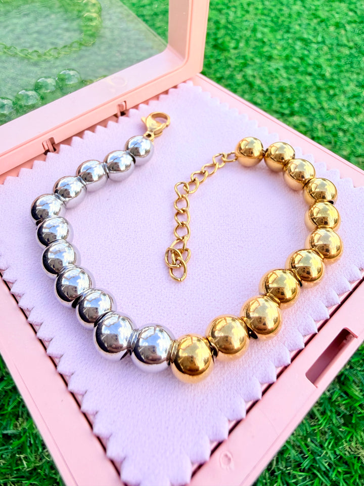 Pulsera de bolitas doble tono